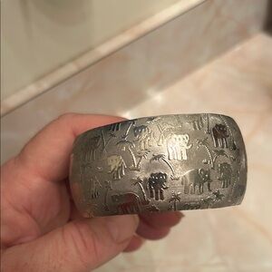 Stainless steeled bangle bracelet with elephant & palm tree design